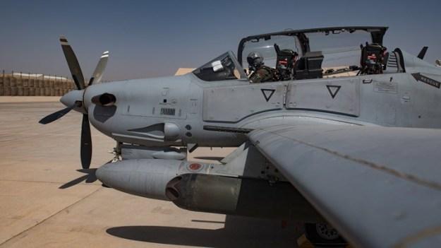 An Afghan A-29 pilot readies his aircraft for flight Sept. 10, 2017, at Kandahar Airfield, Afghanistan. The A-29 is the premier fighter platform for the Afghan Air Force’s fight against anti-government insurgents and for providing close air attack support to troops on the ground. U.S. Air Force photo by Staff Sgt. Alexander W. Riedel – defensemedianetwork.com